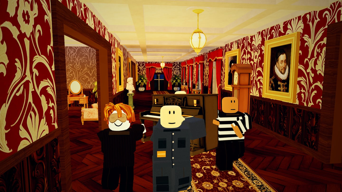 Three of the crew carrying the black upright piano down a long red damask corridor, past gilt-framed portraits and a grandfather clock.