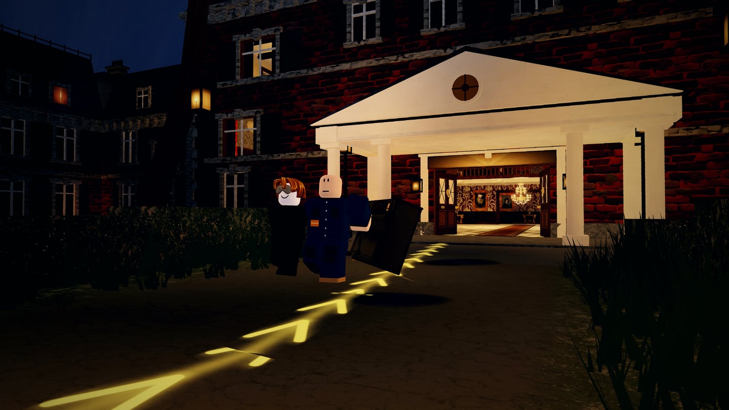 Two of the crew carrying the piano out of the lit porch along the glowing route, in the rain.